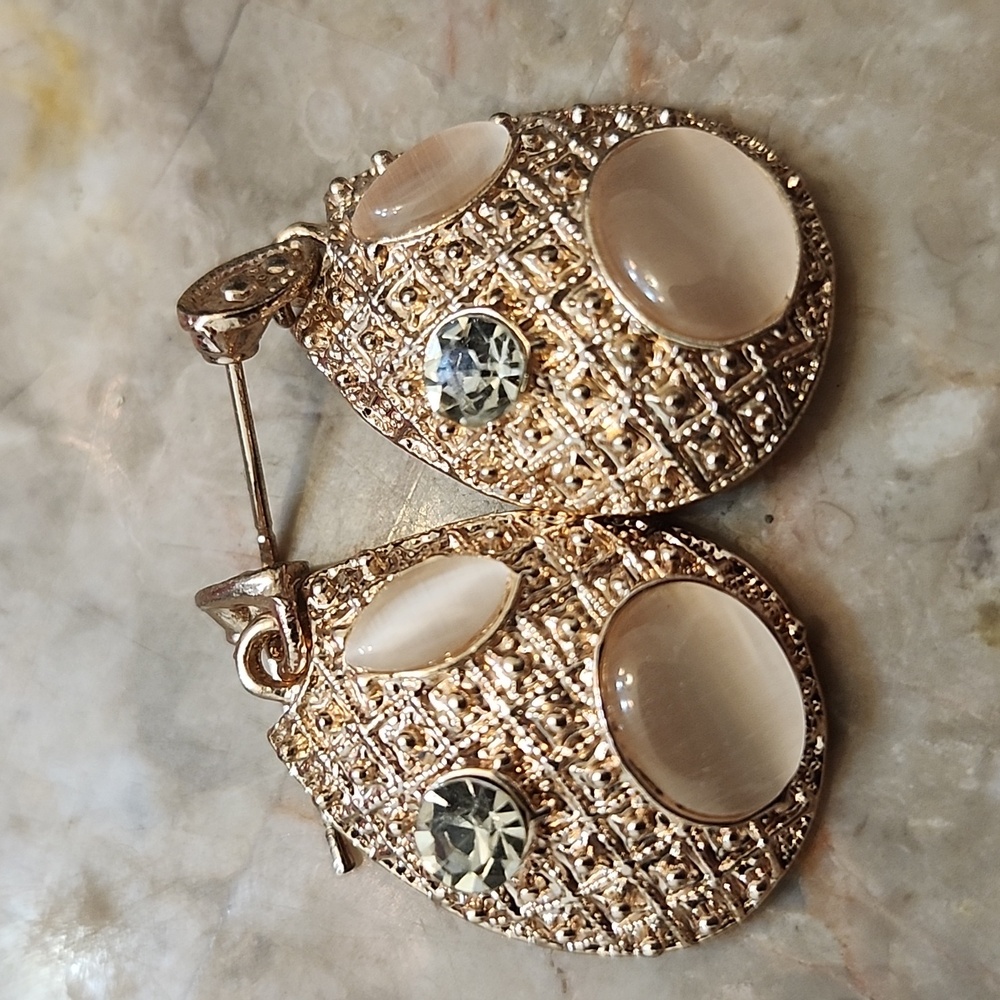 Woman's rose gold and Dimond stone earrings
